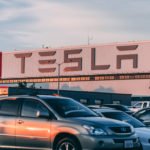 tesla fabric cars parked in front of company building 2449452